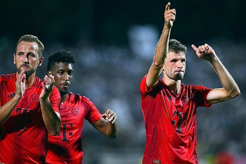 | Photo: Tom Weller/dpa via AP : DFB-Pokal Ulm vs Bayern Munich:  Harry Kane, Kingsley Coman and Thomas Müller celebrate their win